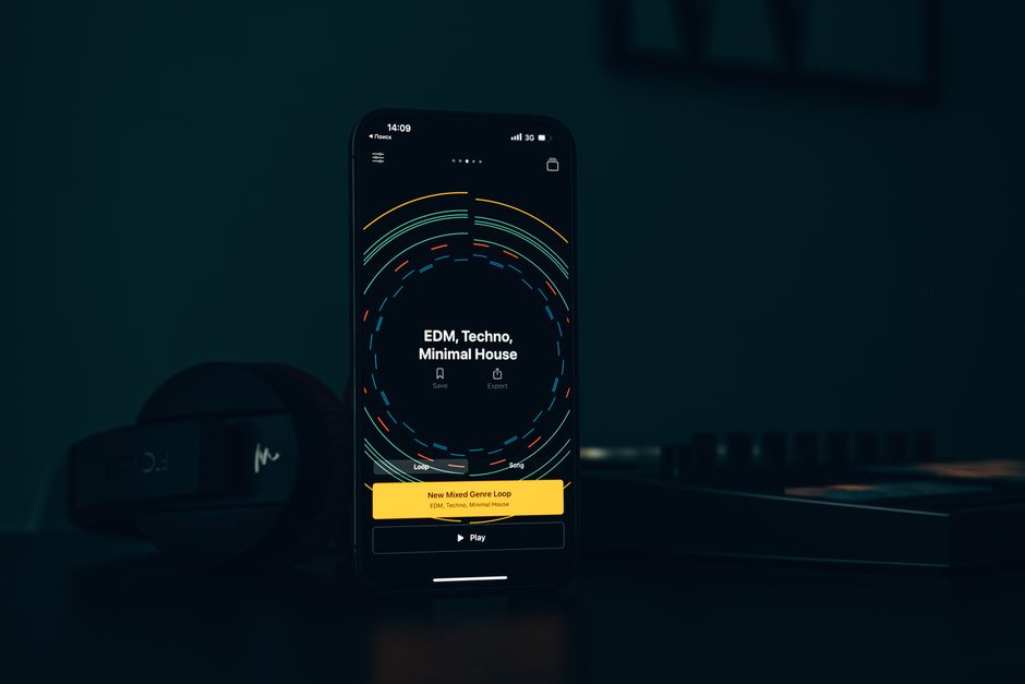 Close-up of a smartphone showing a music app interface featuring EDM, Techno, Minimal House genres.