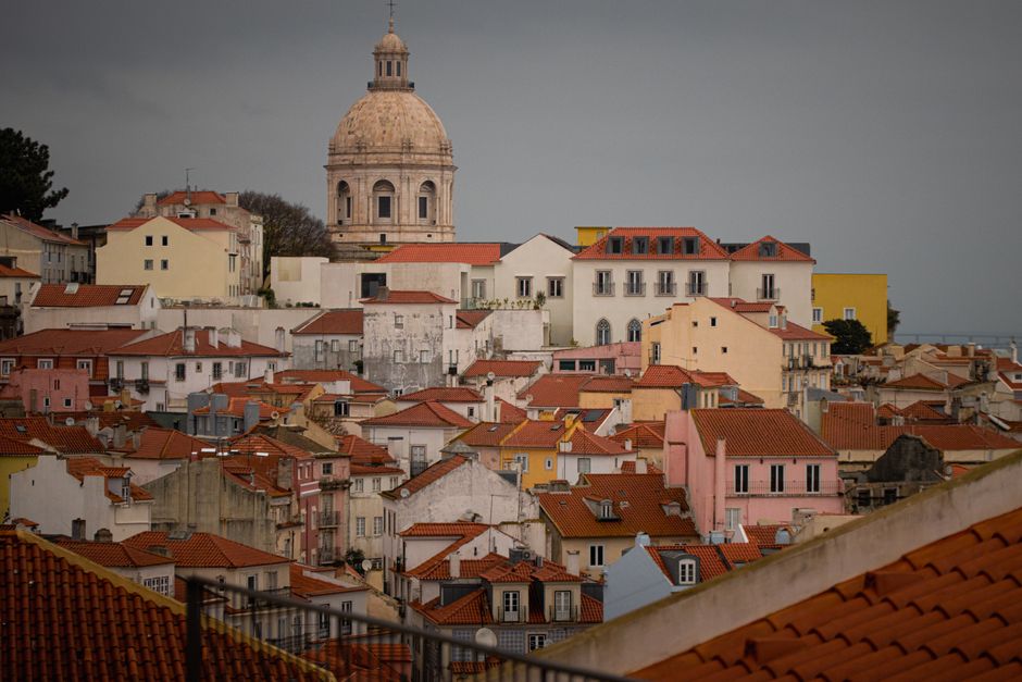 Charming rooftop view of the historic Alfama district in Lisbon, Portugal.