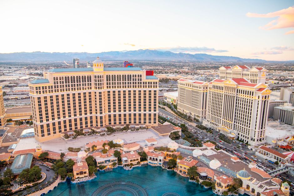 Captivating aerial photo of Las Vegas featuring iconic Bellagio and Caesar's Palace at sunset.