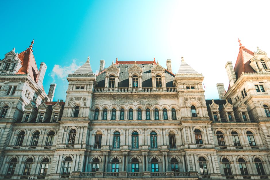 Elegant Renaissance architecture of the New York State Capitol building in Albany under clear sky.