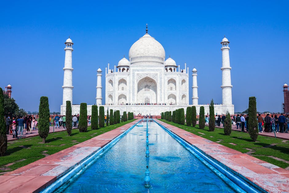 Stunning frontal view of the iconic Taj Mahal in Agra, India, with clear blue skies.