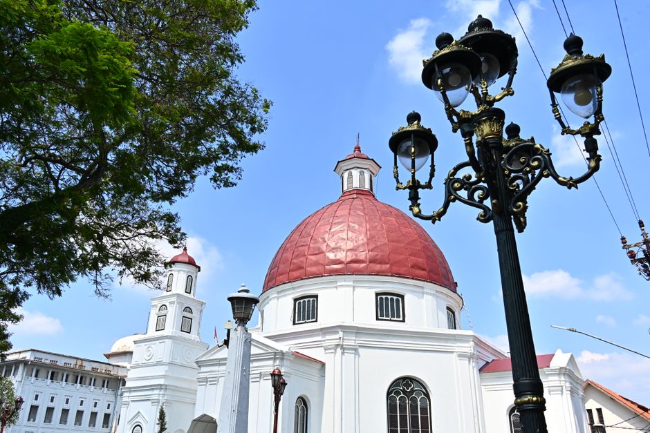 Historic Protestant church with a distinct red dome located in Semarang, Central Java, Indonesia.