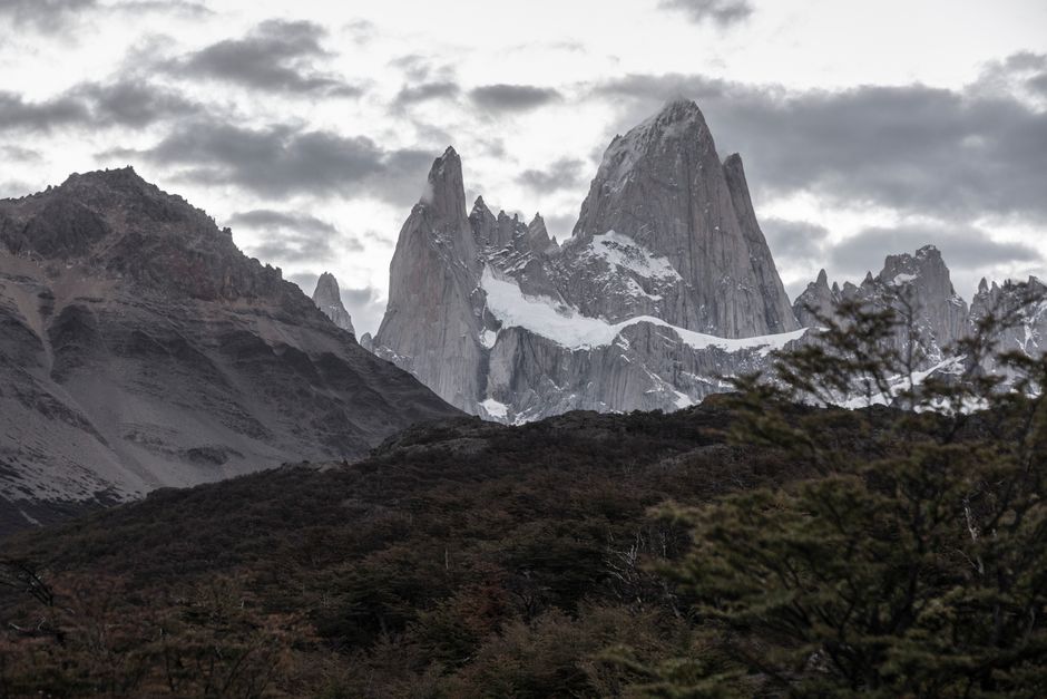 Stunning view of Monte Fitz Roy in Patagonia under a moody sky, showcasing dramatic mountain landscapes.