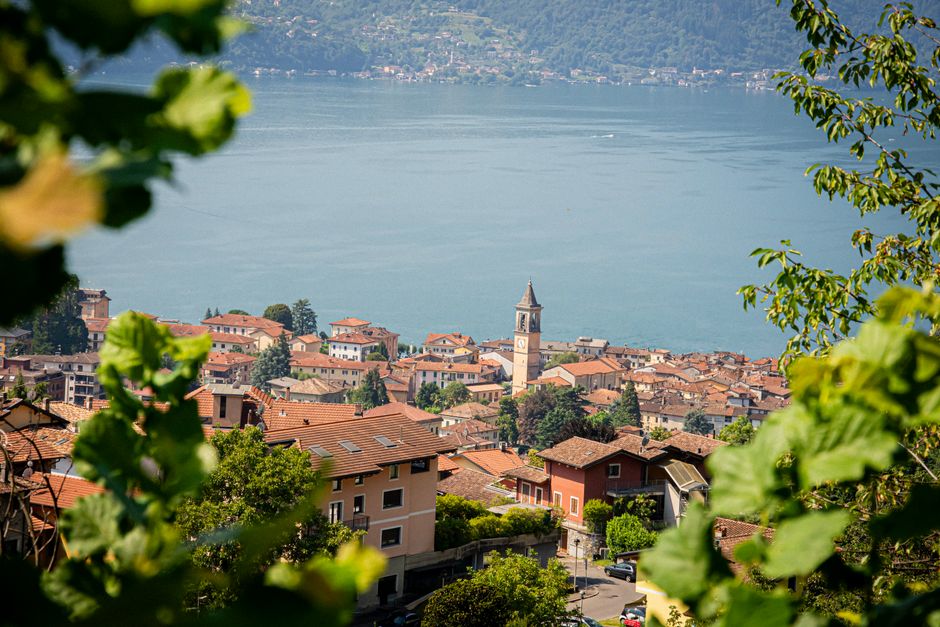 Explore a picturesque village by Lake Como with charming architecture and a tranquil lake backdrop.