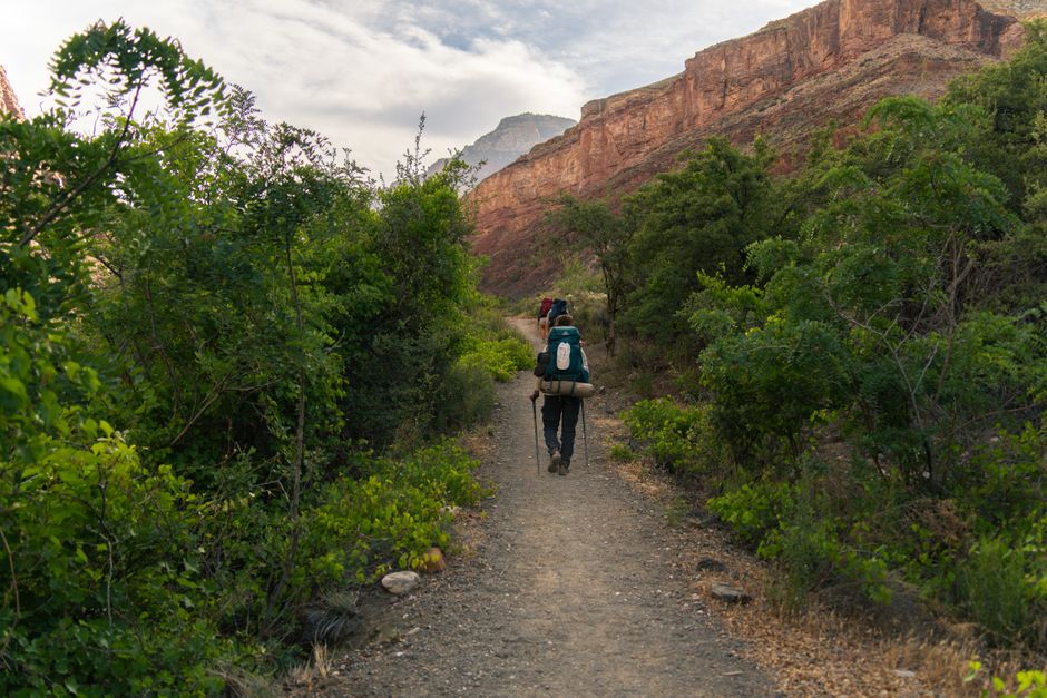 Backpacker traverses a scenic trail in Grand Canyon National Park, Arizona, USA.