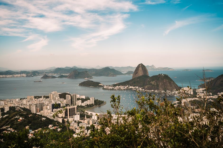 Stunning aerial view of Sugarloaf Mountain in Rio de Janeiro, showcasing vibrant cityscape and ocean.