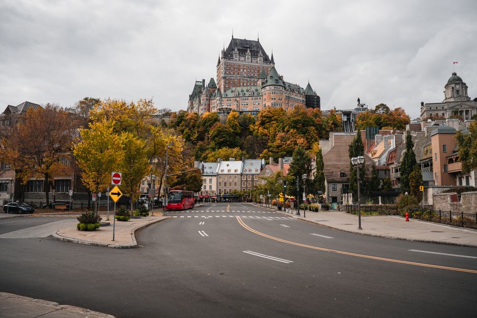 View of Château Frontenac and surrounding historic Old Québec in vibrant fall colors.